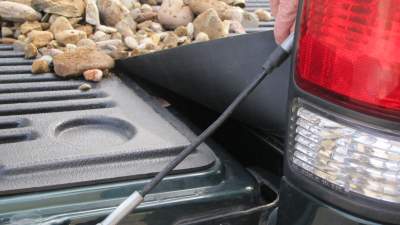 Tailgate gap cover keeps rocks out of gap